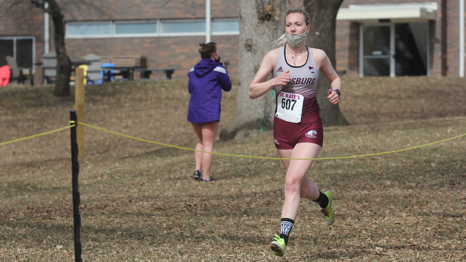 Grace Hartman running in a 2021 cross country race at St. Catherine