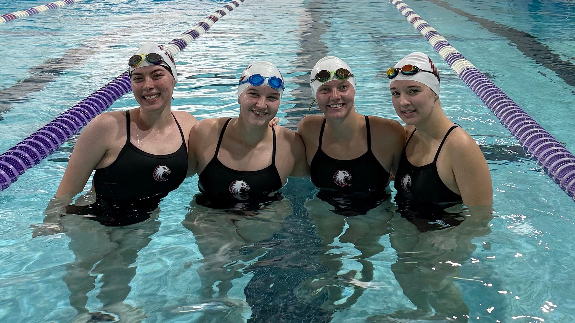 Augsburg women's swimmers pose for a photo before a 2025-26 meet.