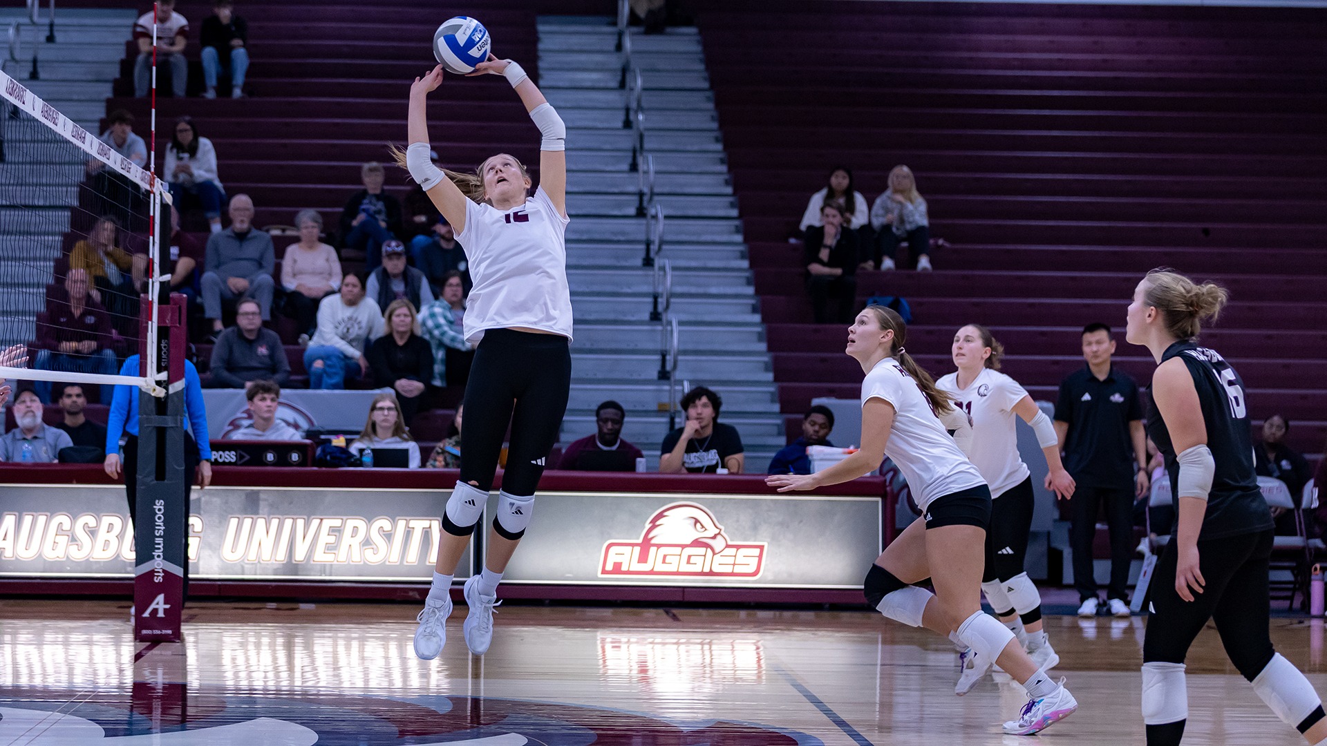 Jovial King jumps for a set during a 2025 Augsburg volleyball match.