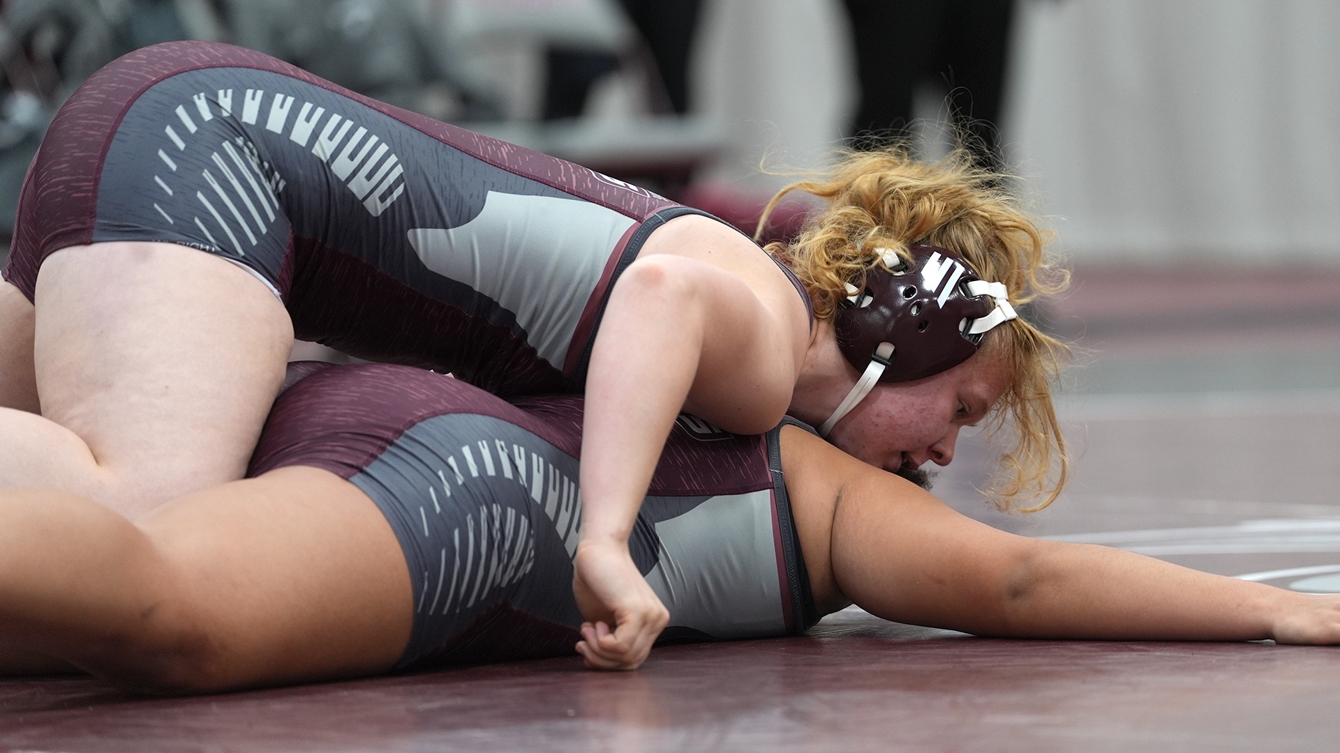 Katie Whelan has control of her opponent during a 2025-26 Augsburg women's wrestling meet.