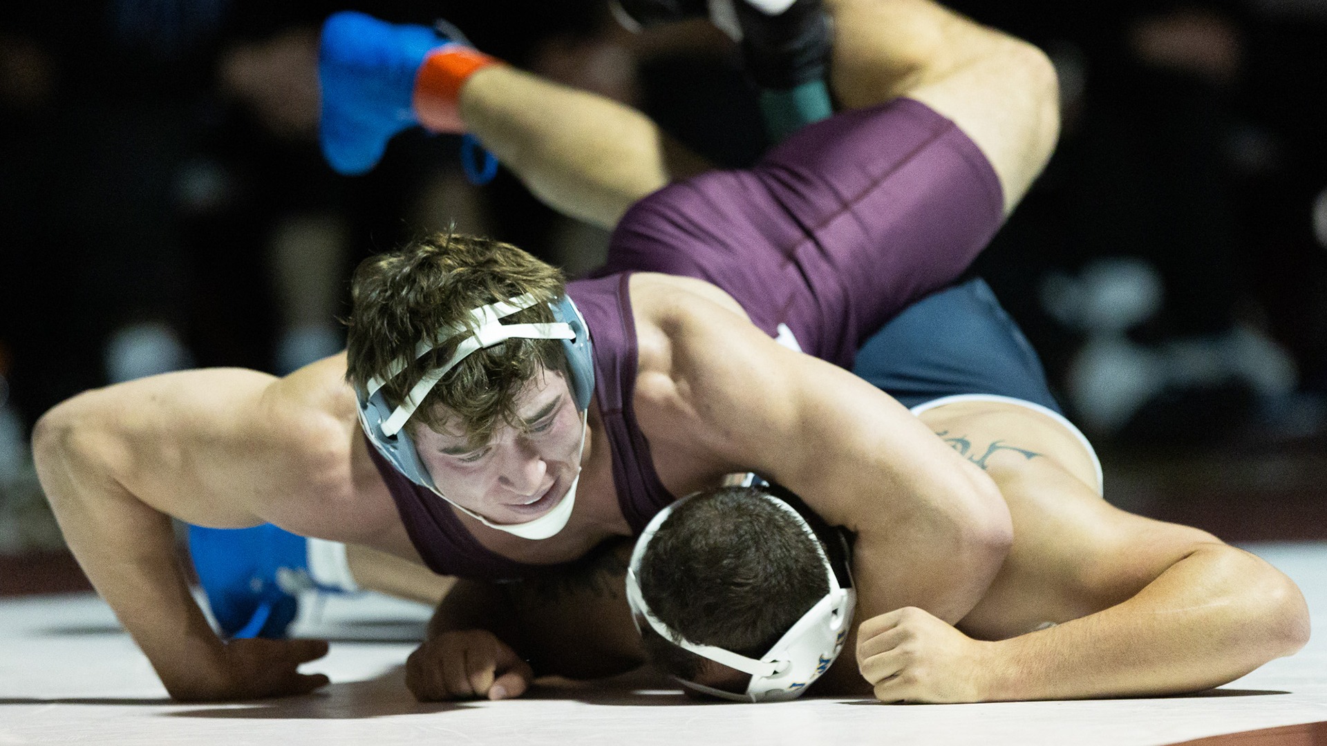 Ethan Winkelman has control of his opponent during a 2025-26 Augsburg men's wrestling meet.