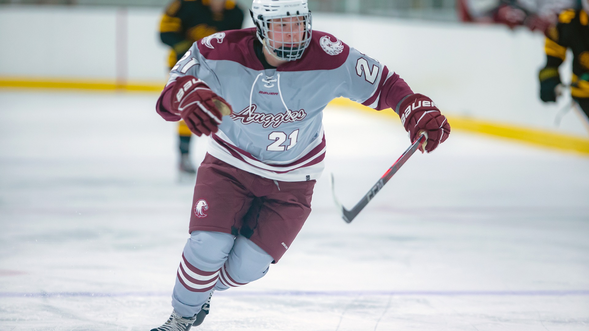 Nora Stepan works her way up the ice during a 2025-26 Augsburg women's hockey game.