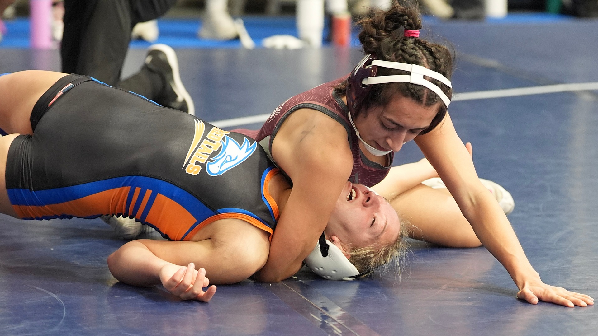 Gisele Gallegos has an opponent in a pin position during a 2025-26 Augsburg women's wrestling meet.