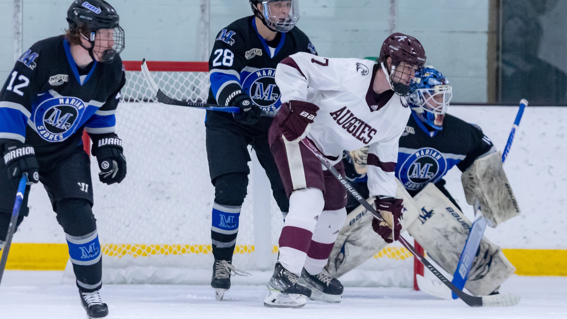 Mason Hendrickson parks in front of the net during a 2025-26 Augsburg men's hockey game.