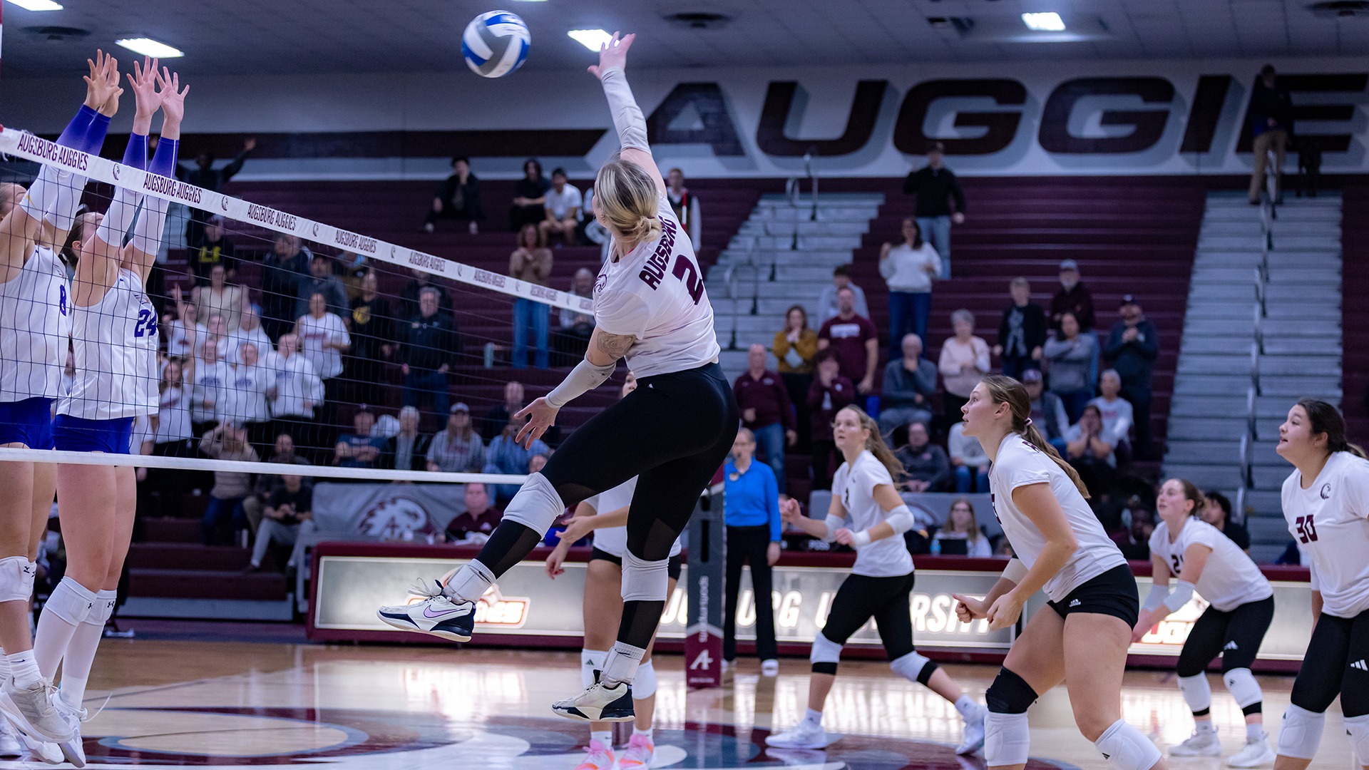 Taliah Triggs attacks the ball during a 2025 Augsburg volleyball match.