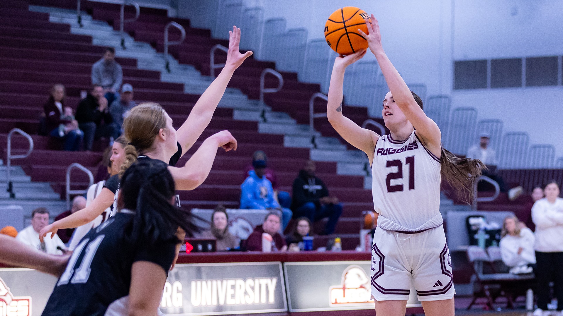 Sydney Hazuga takes a jump shot during a 2025-26 Augsburg women's basketball game.