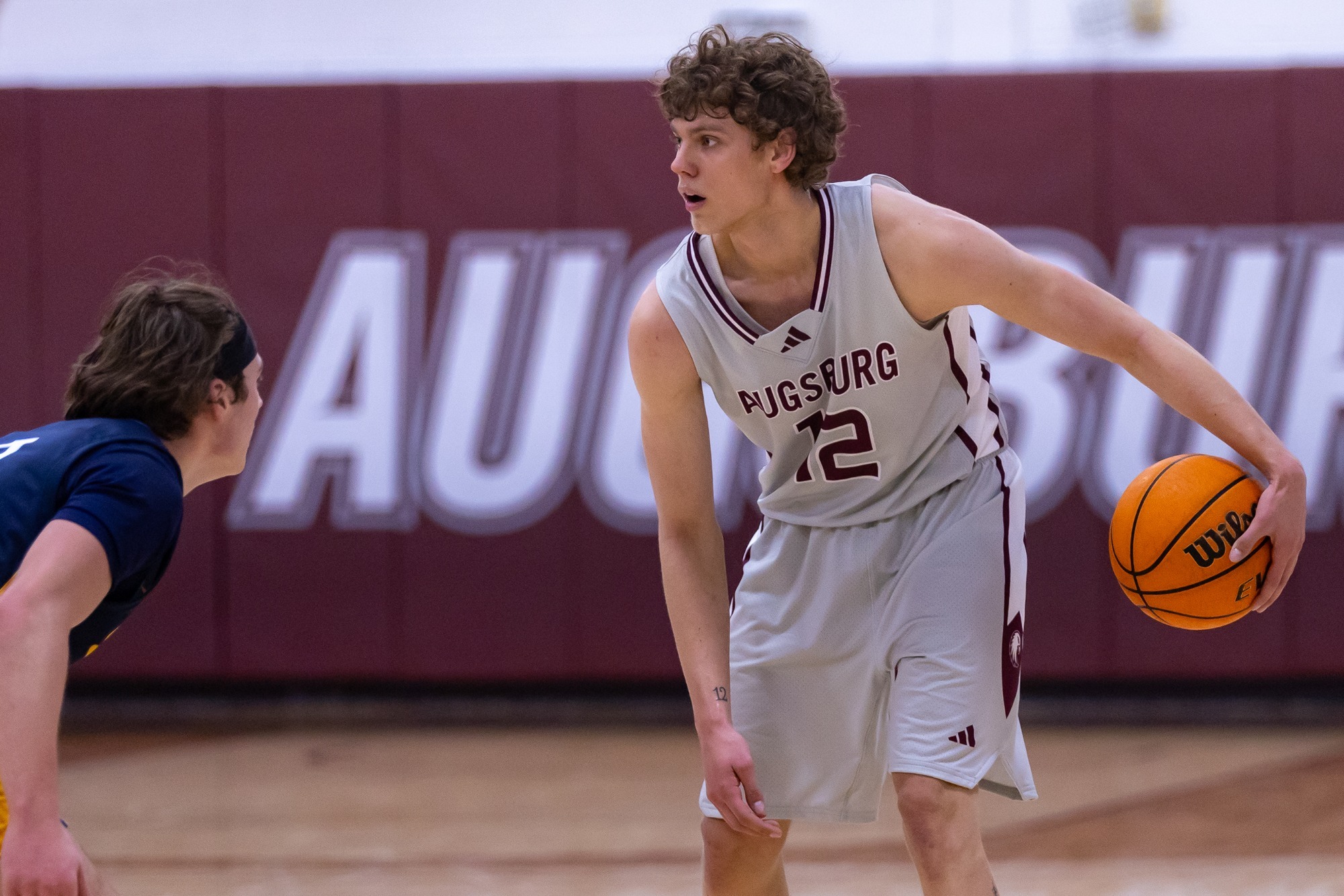 JJ Semanko handles the ball during a 2025-26 Augsburg men's basketball game.