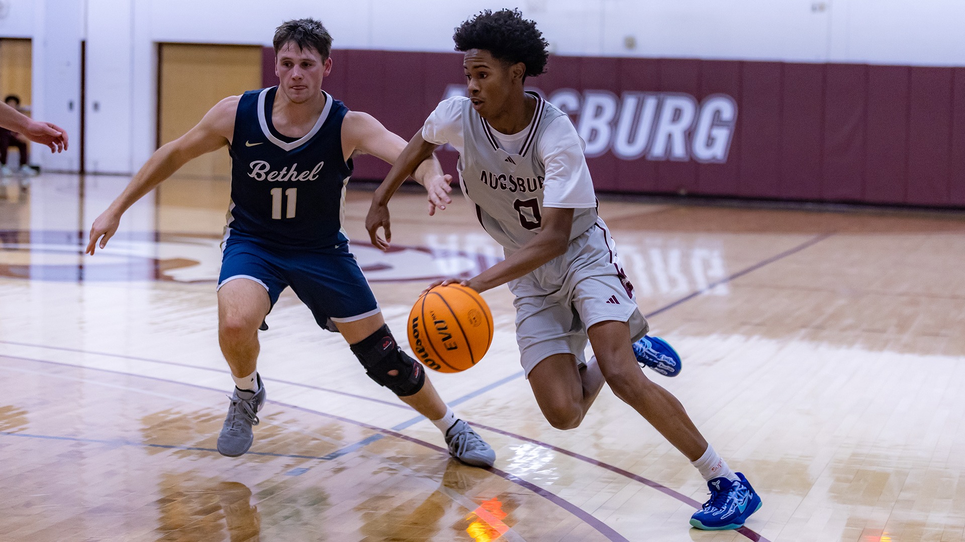 Daveion Hart handles the ball during a 2025-26 Augsburg men's basketball game.