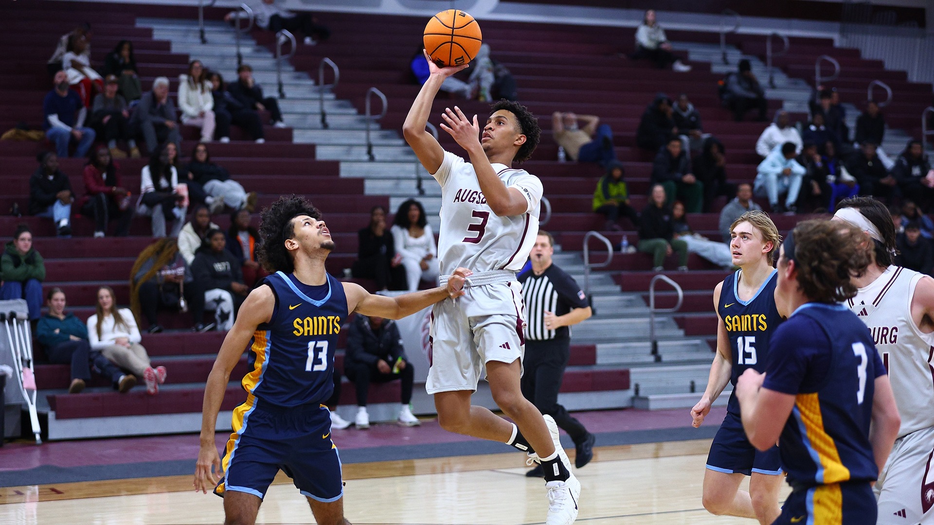 Hanif Muhammad puts up a shot during a 2025-26 Augsburg men's basketball game.
