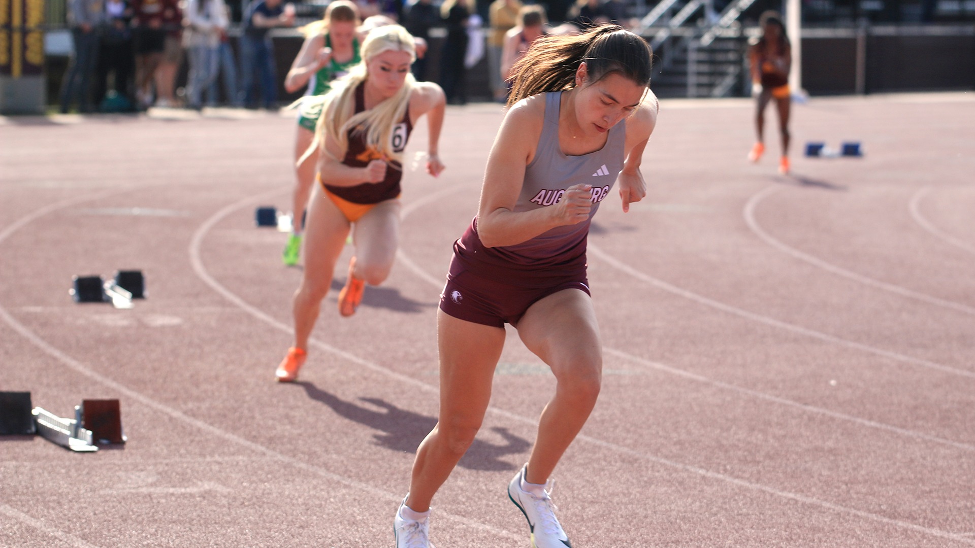 Allison Hookom takes off from the starting blocks during a 2025 Augsburg women's track and field meet.