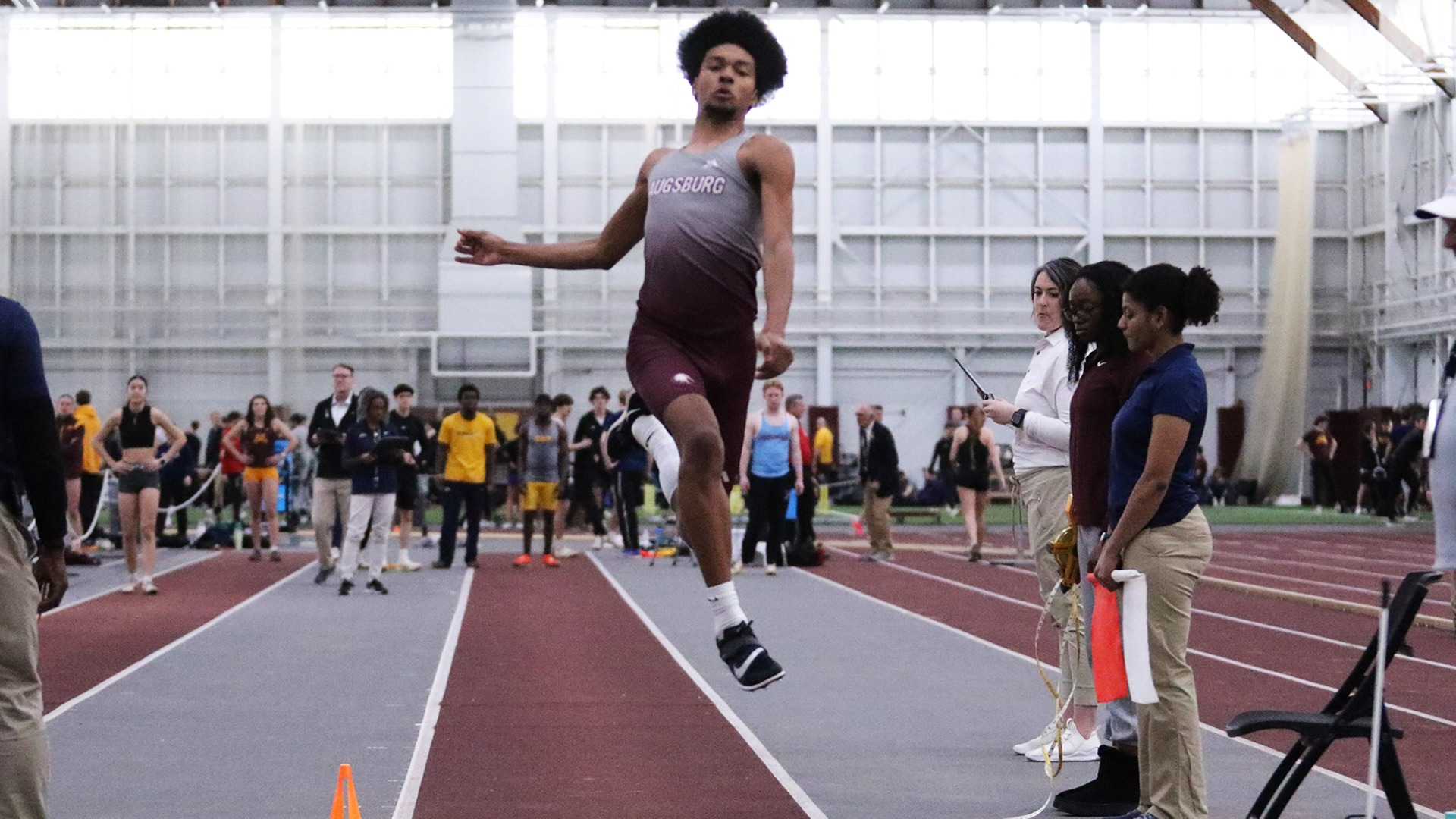 Brandon Travis jumps in the long jump during a 2025 Augsburg track and field meet.