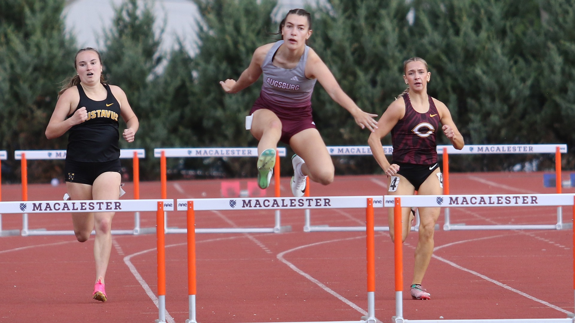 Allison Hookom clears a hurdle during a 2025 Augsburg track and field meet.