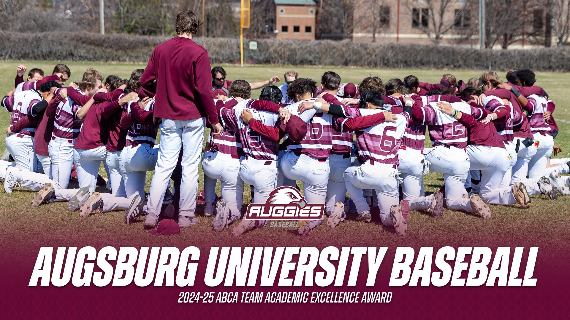 Augsburg baseball players gather in a huddle before a 2025 game. On the photo is the Augsburg baseball logo and the text: 