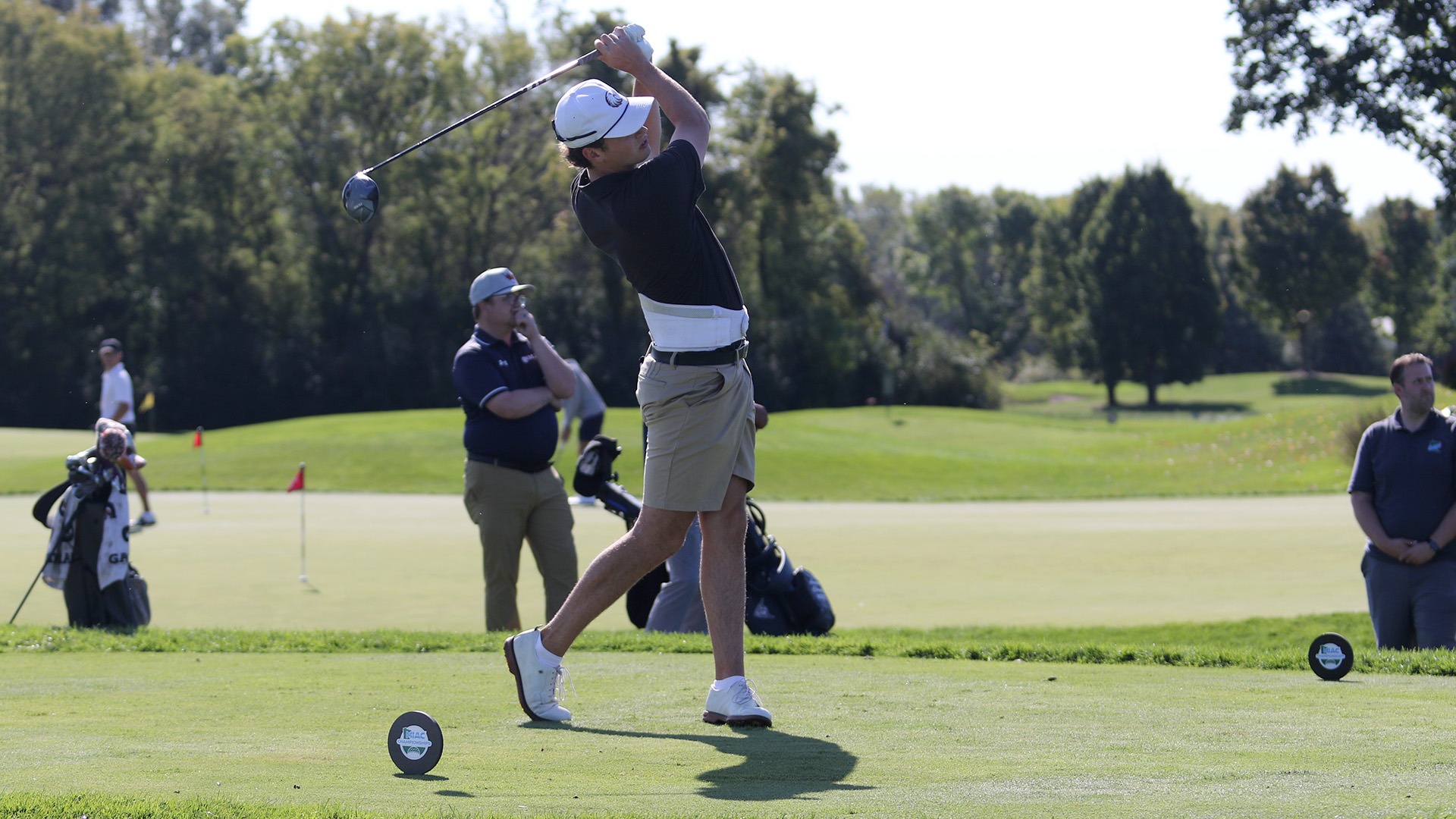 Jack Berry tees off during a 2025-26 Augsburg men's golf meet.