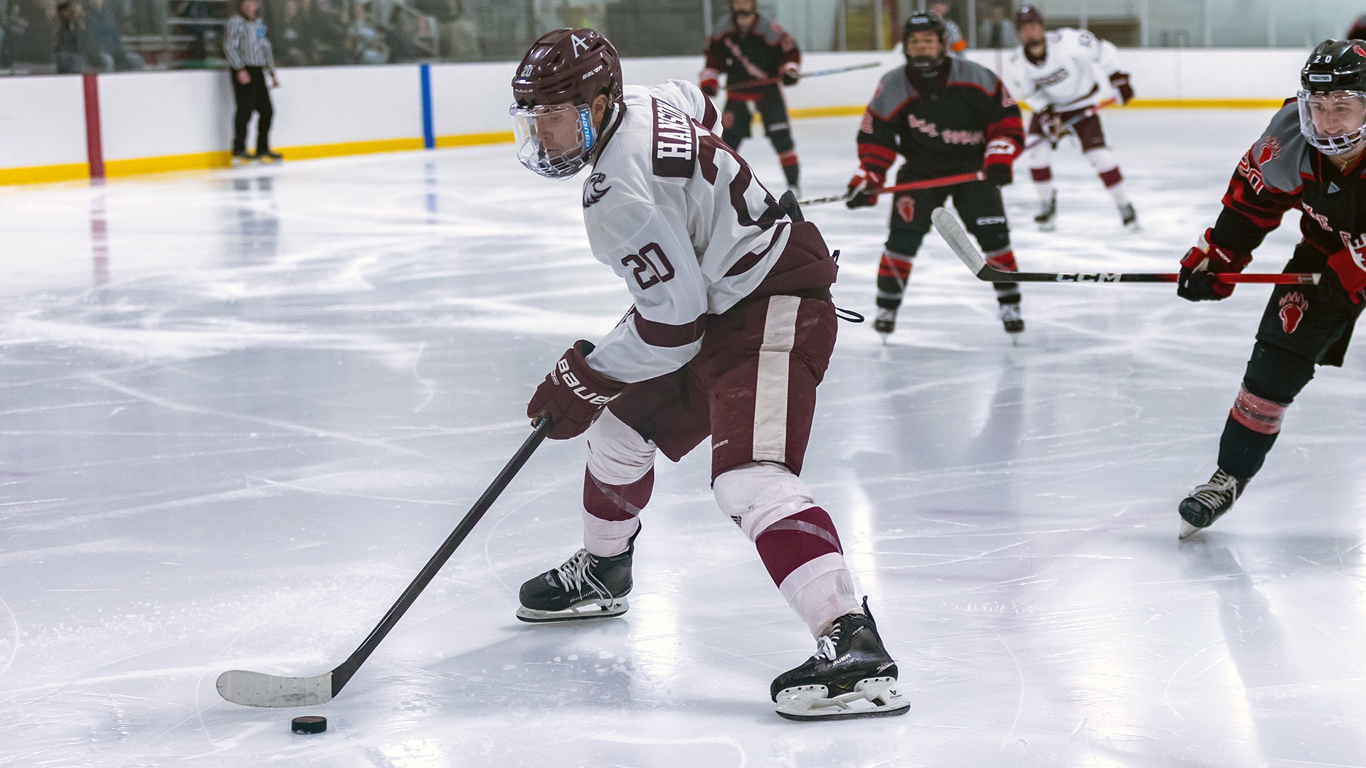 Peyton Hanson takes a shot during a 2025-26 Augsburg men's hockey game.
