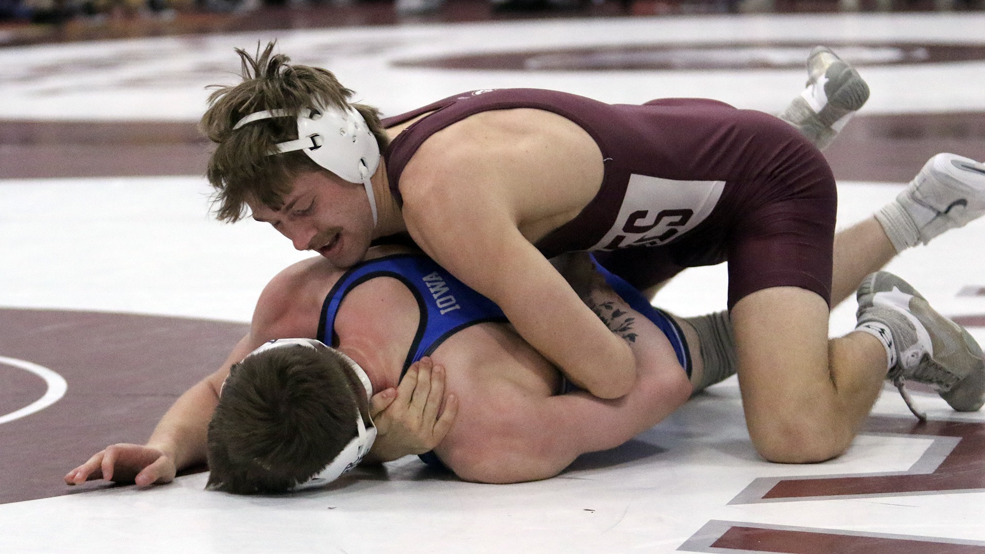 Cooper Willis controls an opponent during a 2025-26 Augsburg men's wrestling meet.
