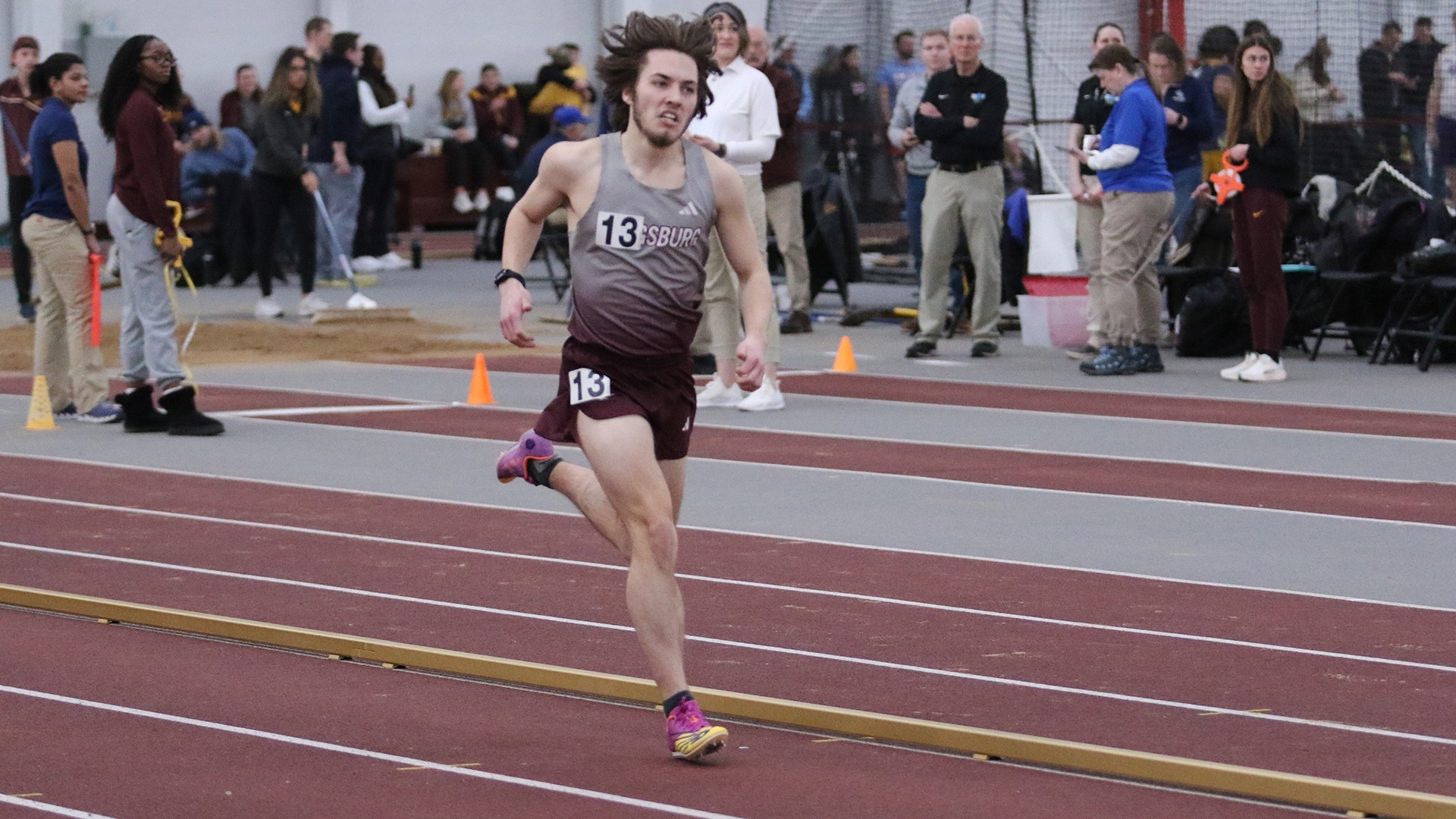Henry Nelson runs during a 2025 Augsburg track and field meet.