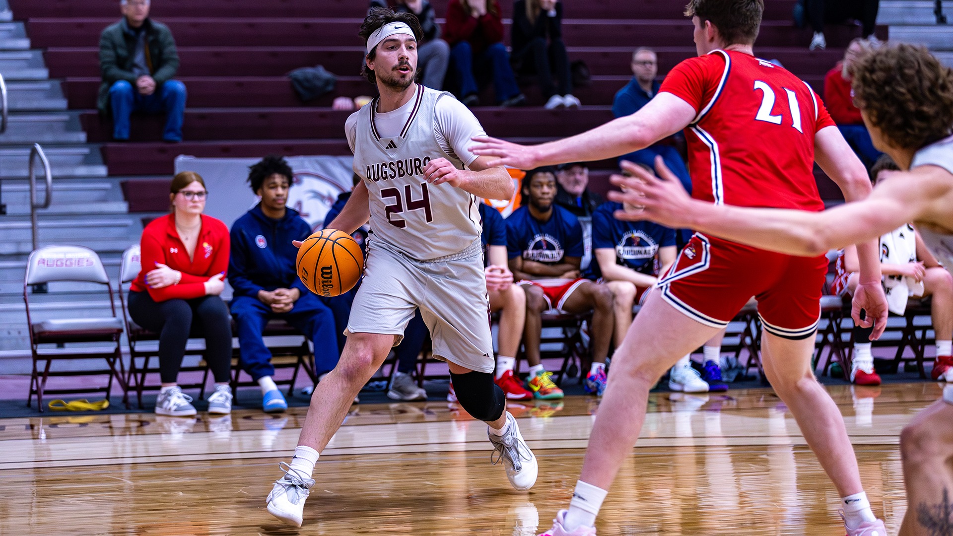 Isaac Rabaey looks for someone to pass to during a 2025-26 Augsburg men's basketball game.