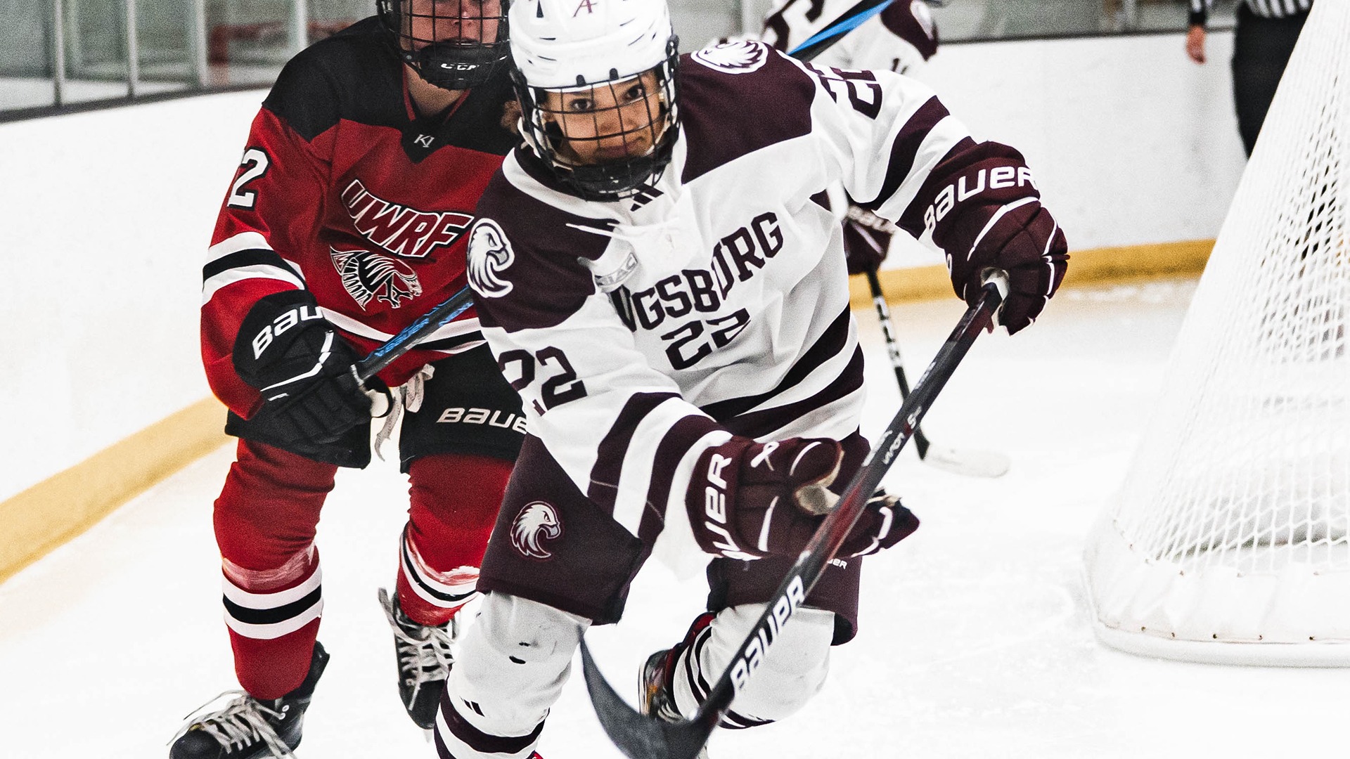 Aunna Schulte pursues the puck during a 2025-26 Augsburg women's hockey game.