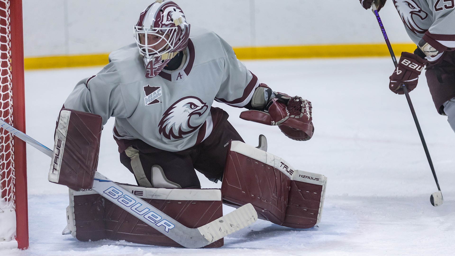 Alex Timmons watches the action from the goal during a 2025-26 Augsburg men's hockey game.