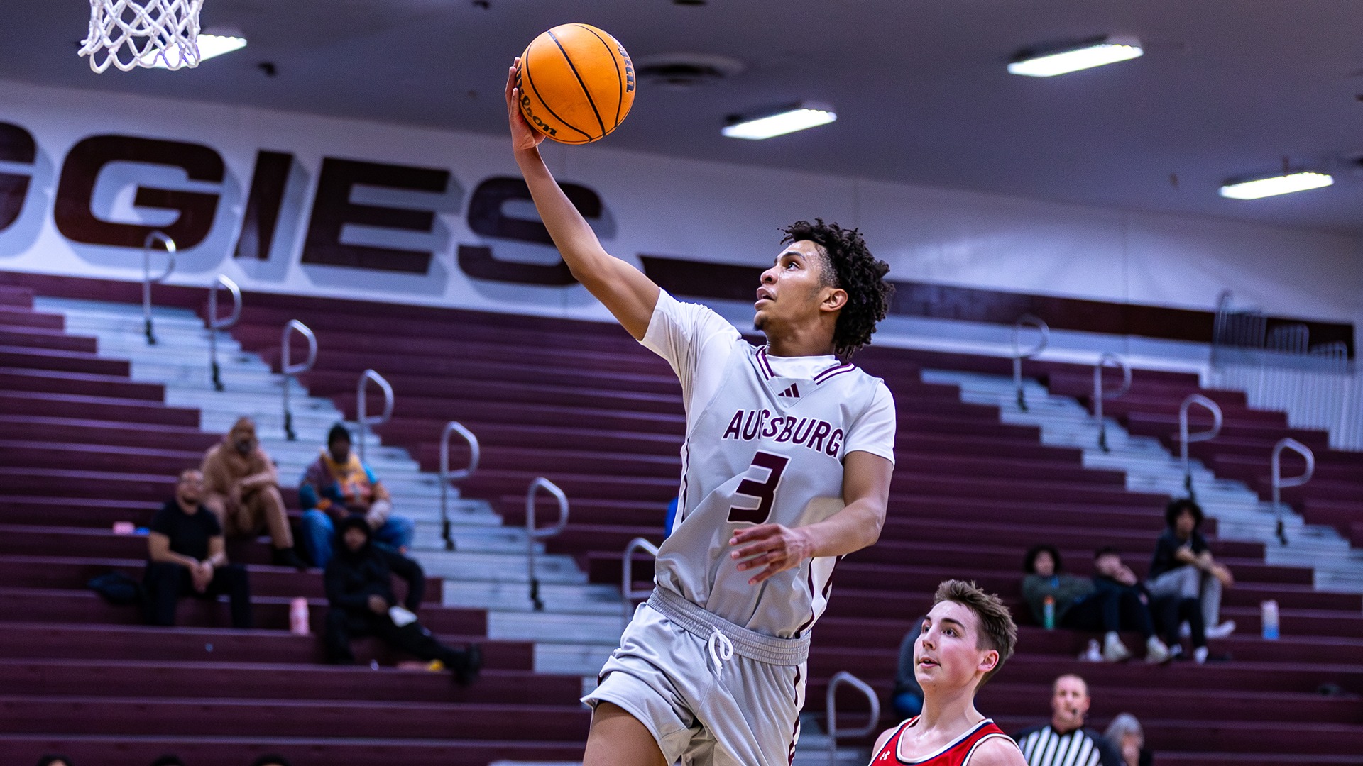 Hanif Muhammad shoots a layup during a 2025-26 Augsburg men's basketball game.