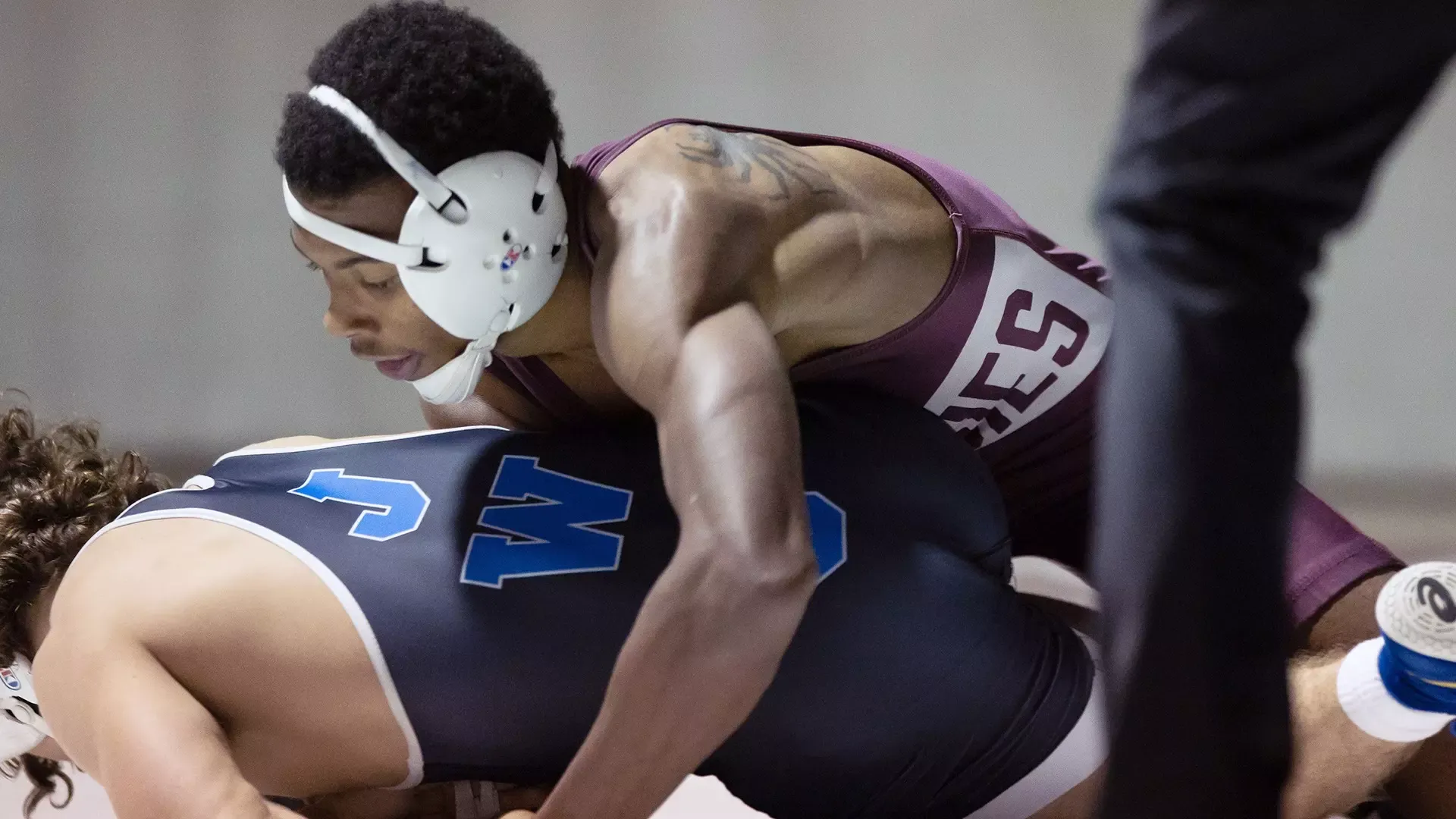 Keno Vanier has control of an opponent during a 2025-26 Augsburg men's wrestling meet.