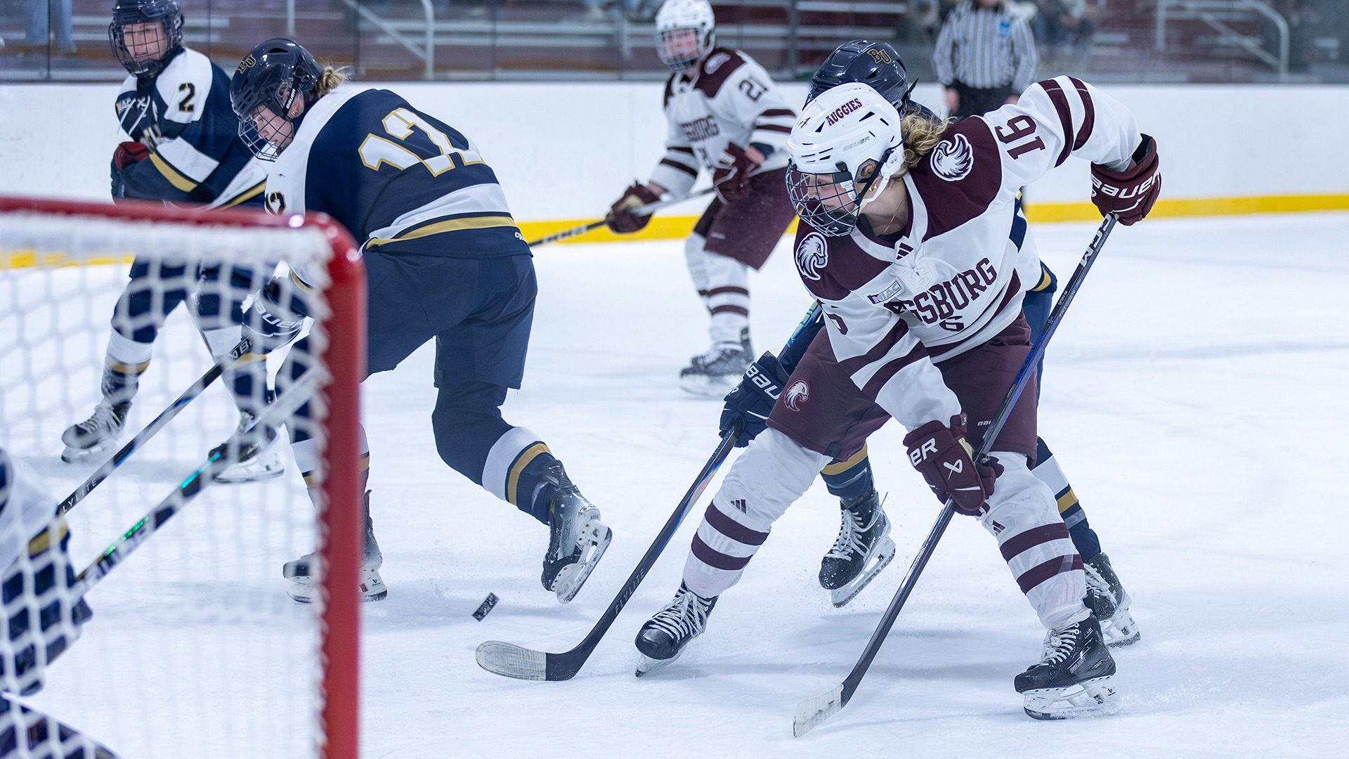 Kate Haug waits for the puck in front of the goal during a 2025-26 Augsburg women's hockey game.