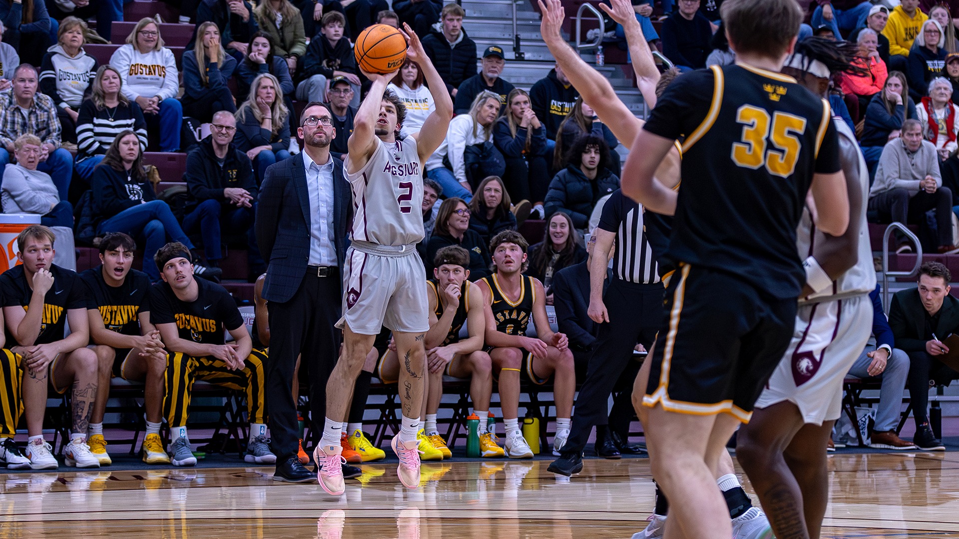 Keenan Rodriguez takes an outside shot during a 2025-26 Augsburg men's basketball game.