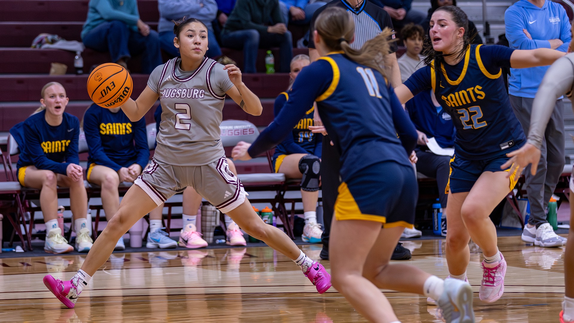 Wakinyela Bear handles the basketball during a 2025-26 Augsburg women's basketball game.