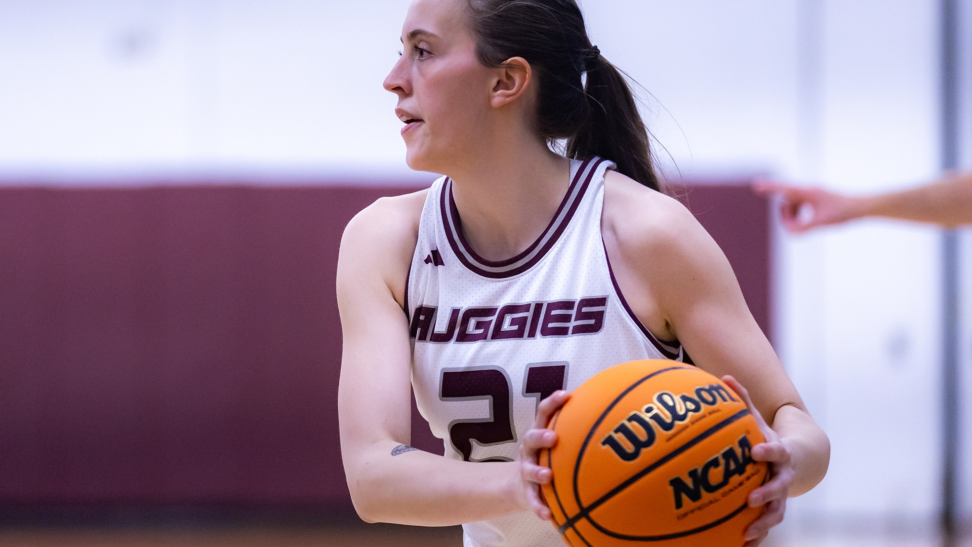 Sydney Hazuga handles the ball during a 2025-26 Augsburg women's basketball game.