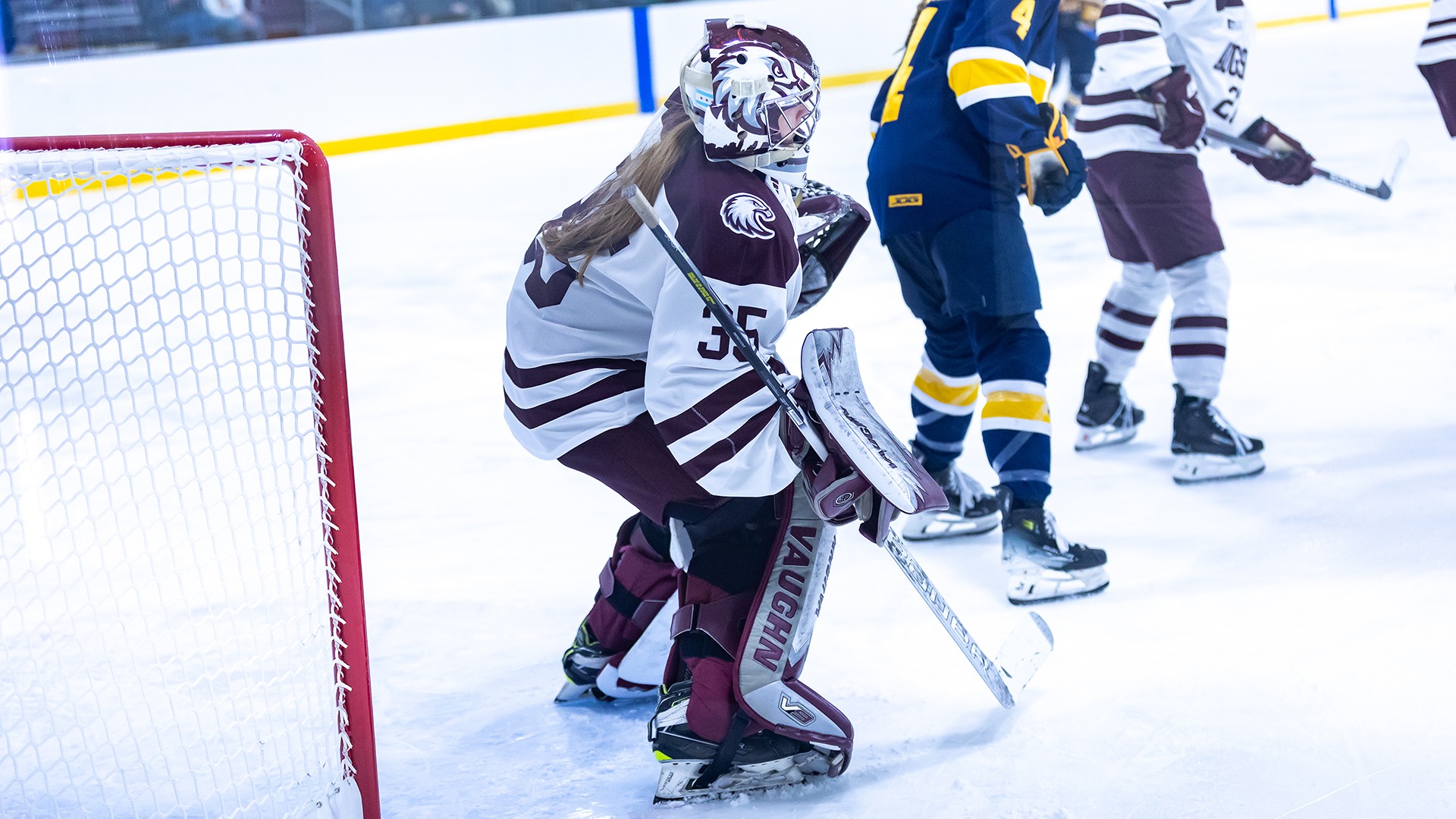 Marissa Paaske watches the action from goal during a 2025-26 Augsburg women's hockey game.