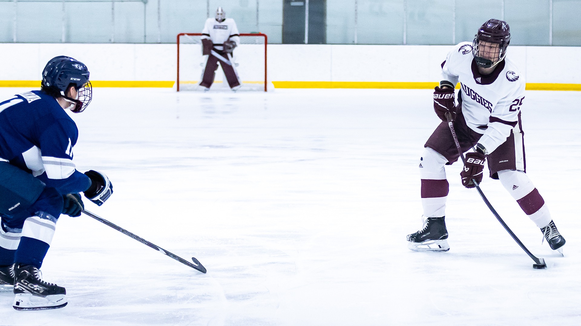 Zachary Reim takes a shot during a 2025-26 Augsburg men's hockey game.