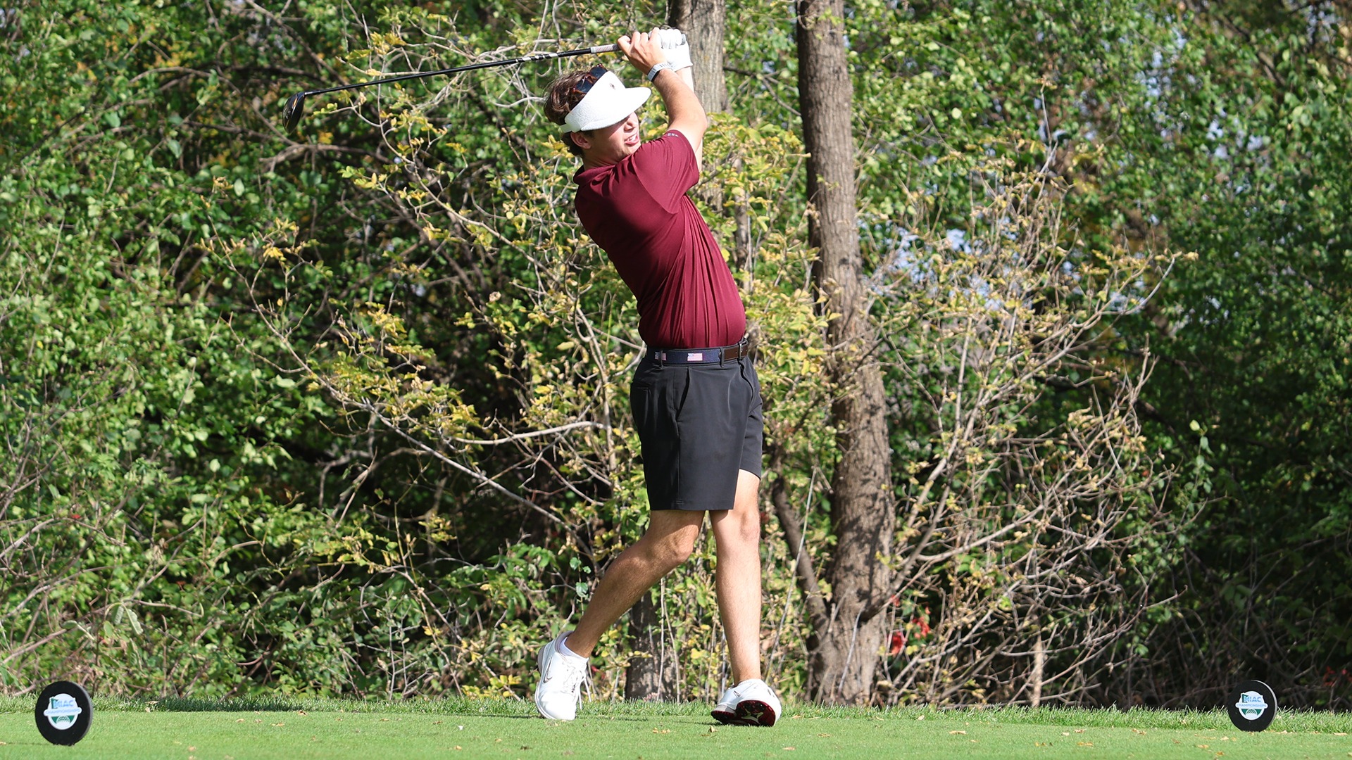Jack Berry tees off during a 2026-27 Augsburg men's golf meet.