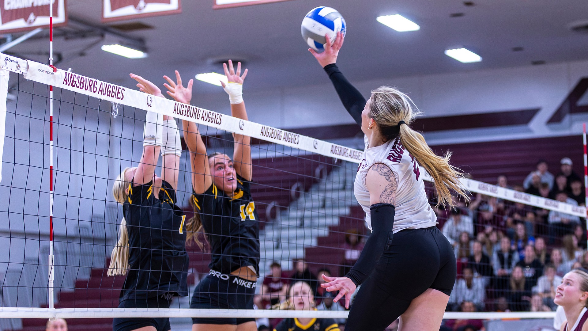 Taliah Triggs puts the ball over a block during a 2026 Augsburg volleyball match.