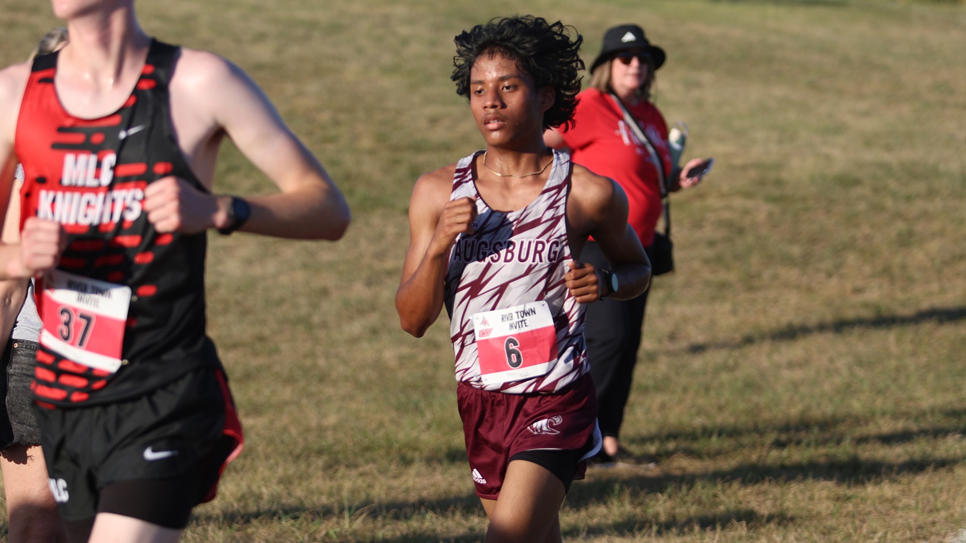 Jairdan Thomas runs during a 2026 Augsburg men's cross country meet.