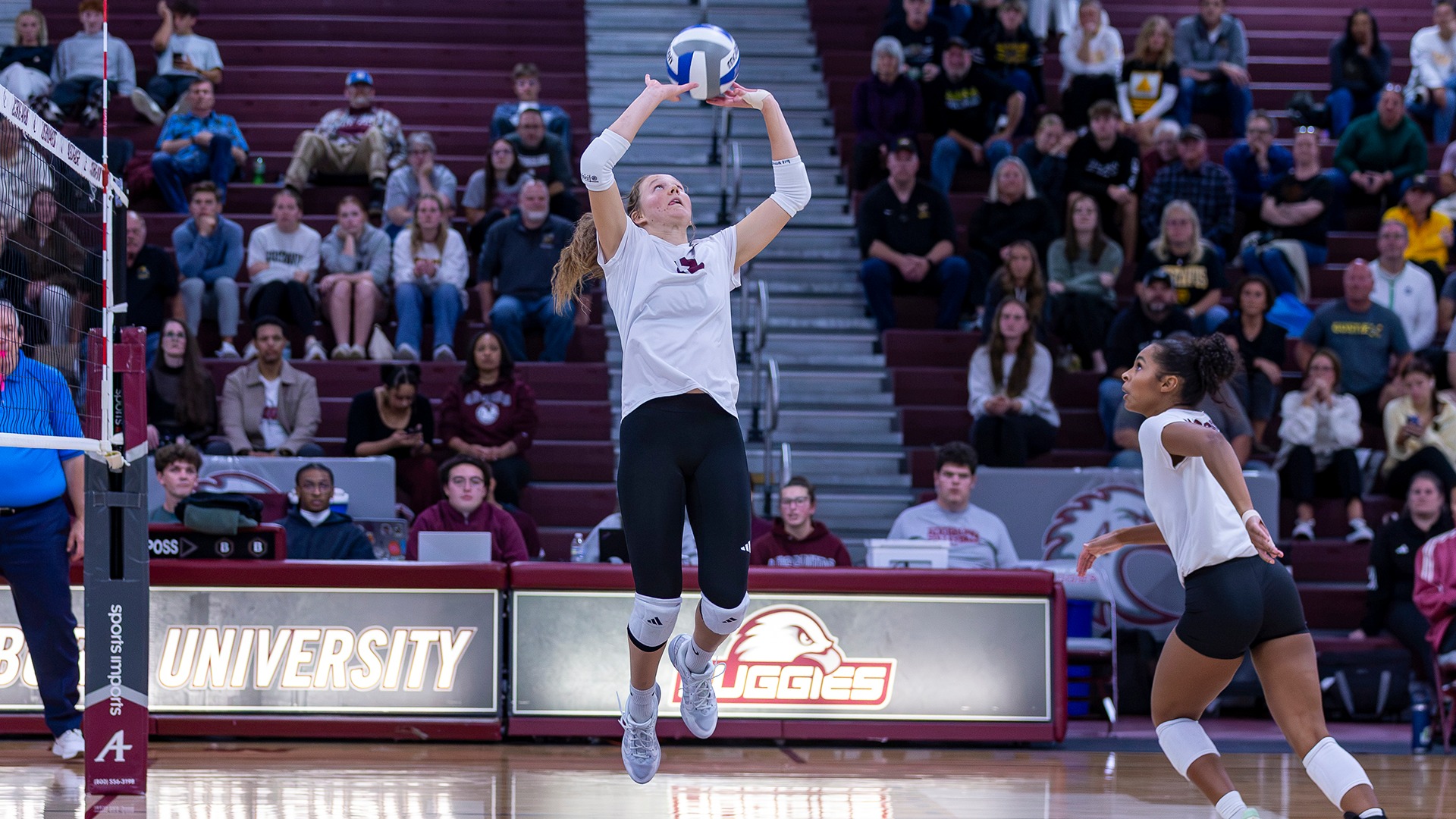Jovial King sets the ball during a 2026 Augsburg volleyball match.