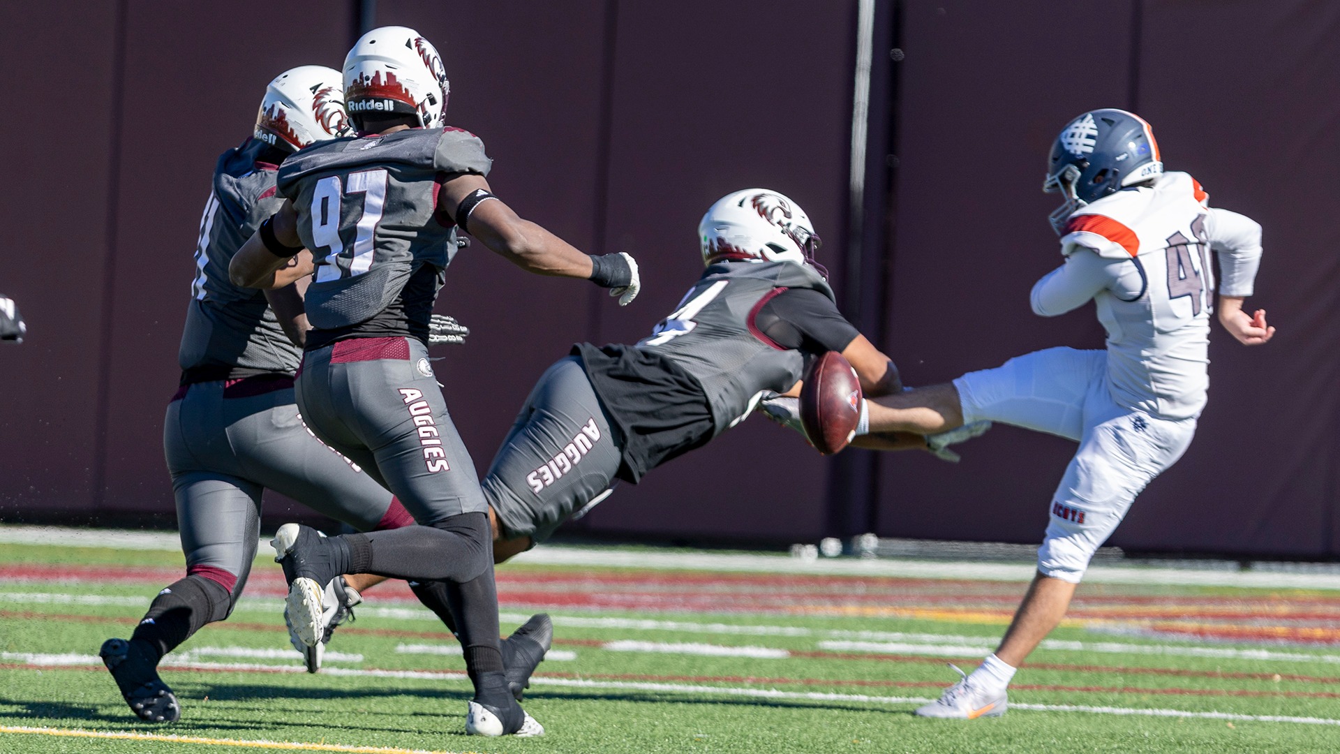 RJ Chakolis blocks a punt during a 2026 Augsburg football game.