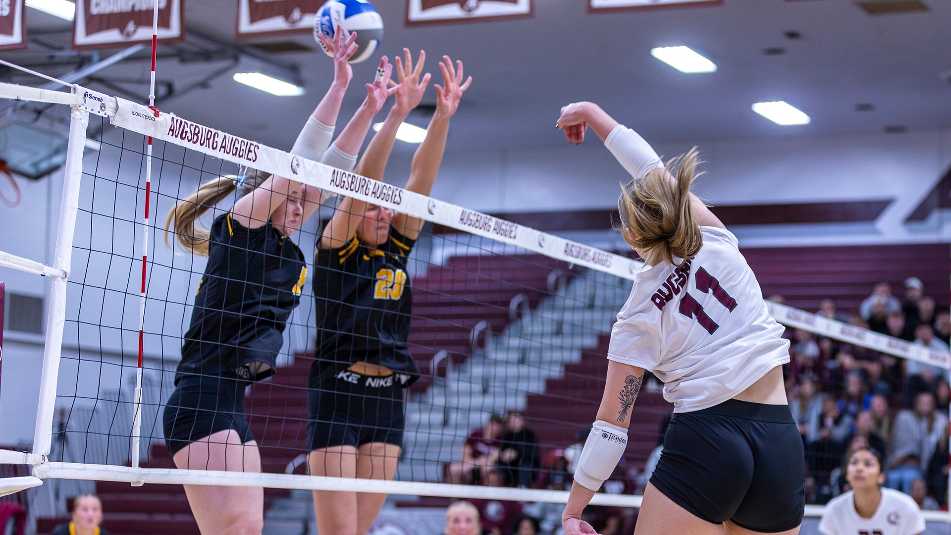 Aloaha Ricke attacks the net during a 2026 Augsburg volleyball match.