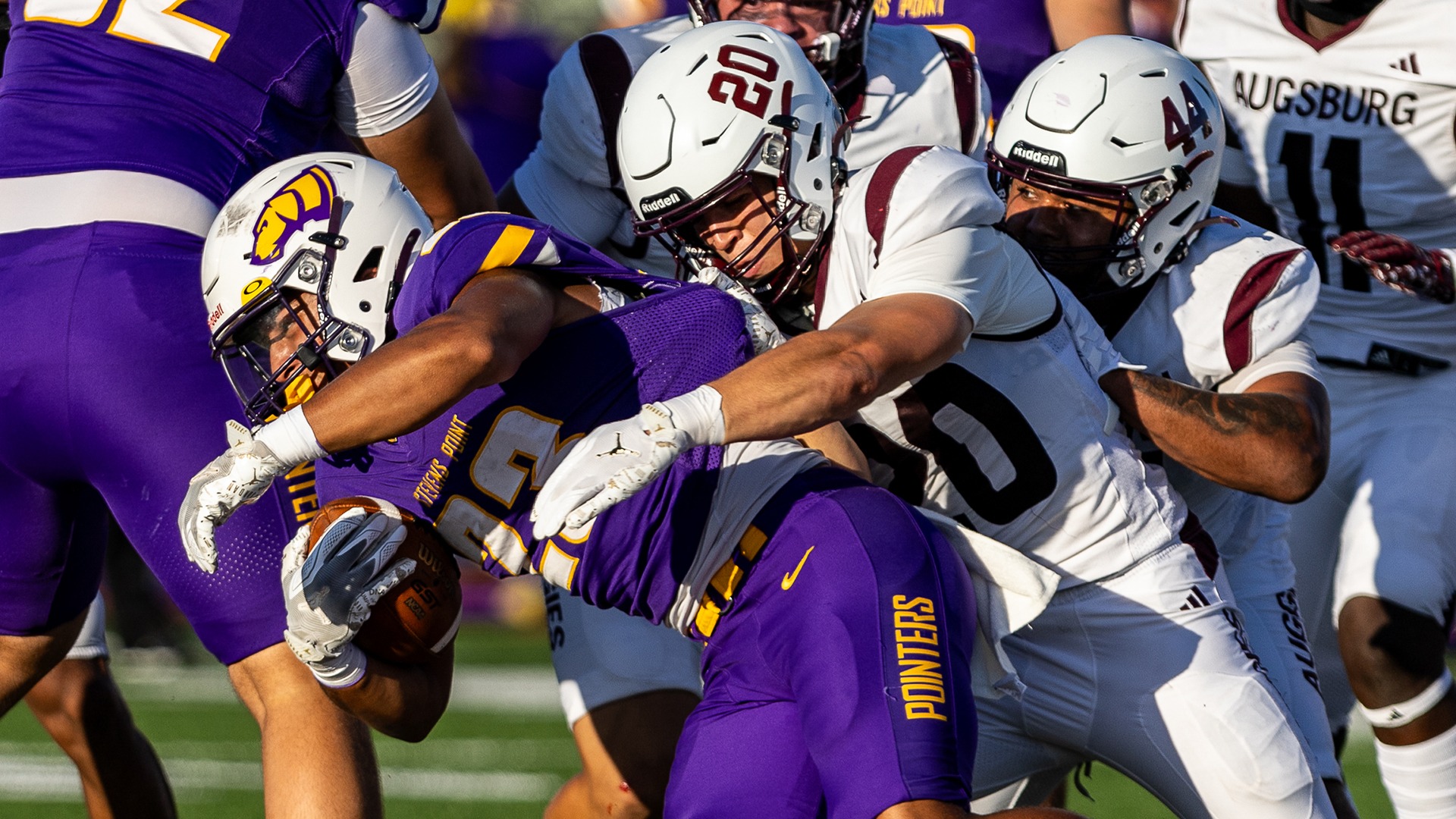 Foster Mulvehill wraps up an opponent during a 2026 Augsburg football game.