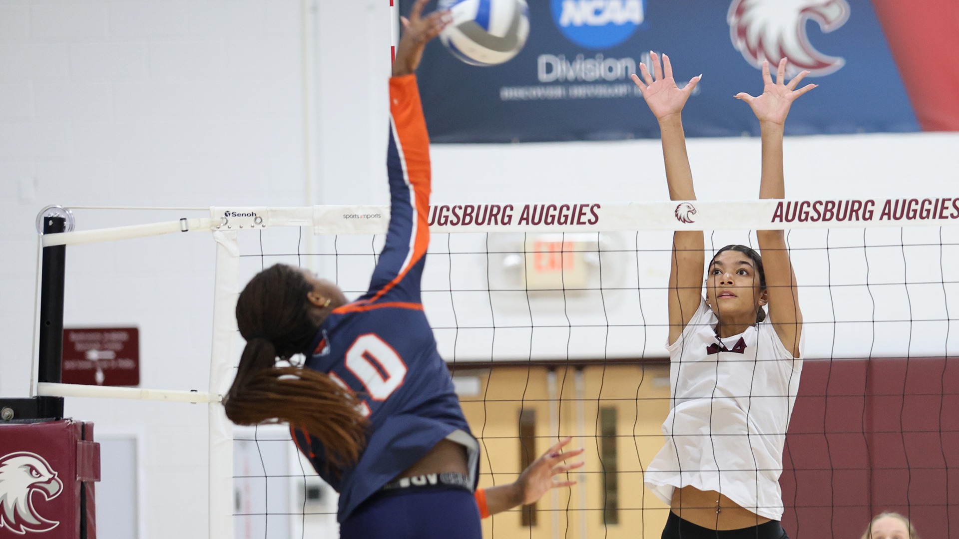 Lilly Wynn goes up for a block during a 2026 Augsburg volleyball match.