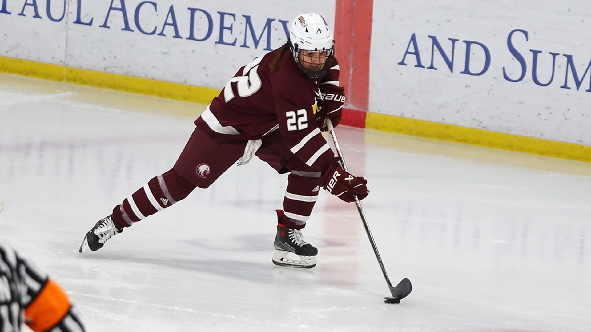 Aunna Schulte brings the puck up the ice during a 2025-26 Augsburg women's hockey game.