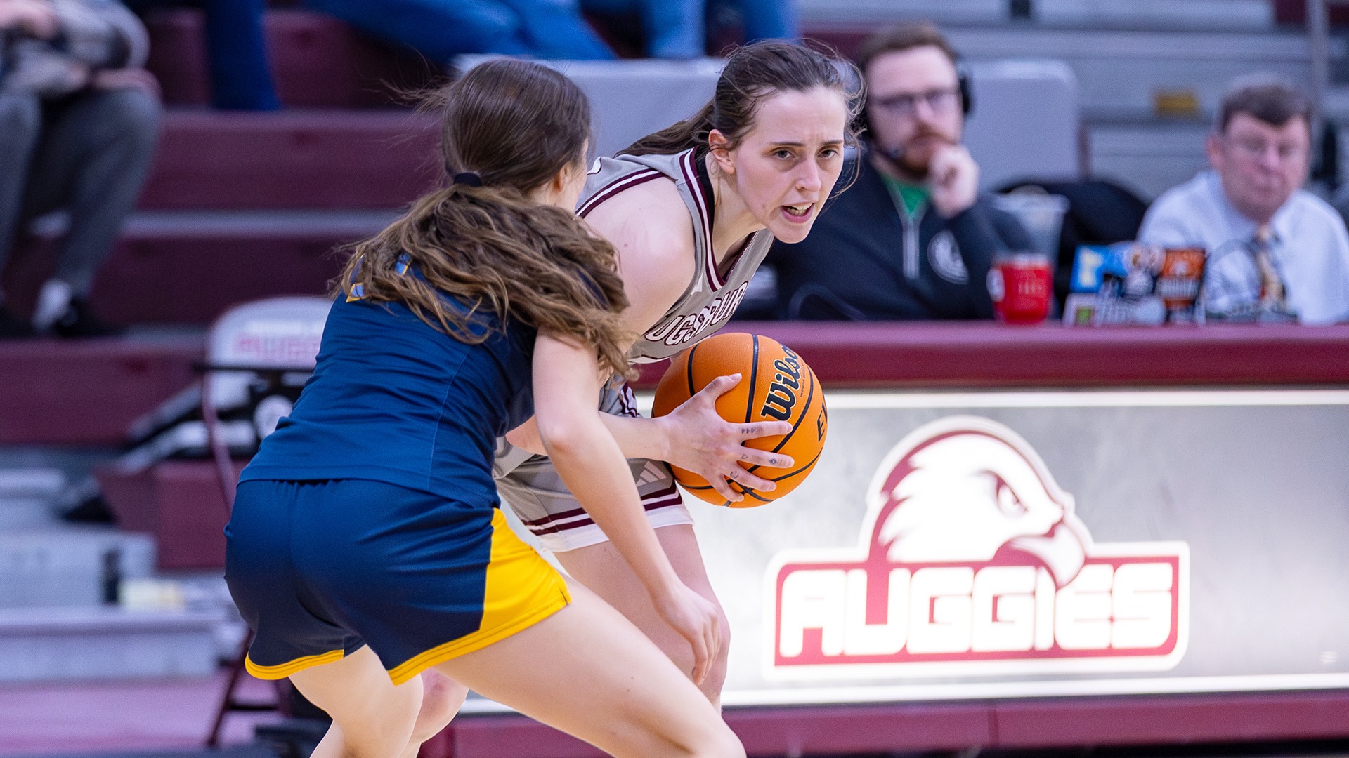 Sydney Hazuga faces a defender during a 2025-26 Augsburg women's basketball game.