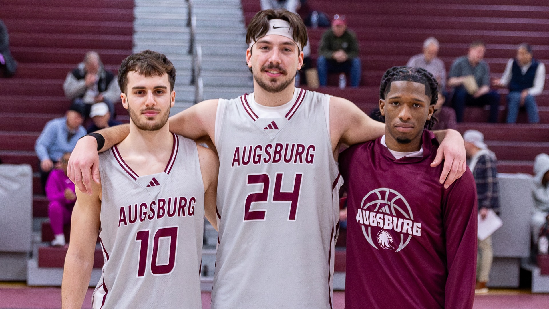 Augsburg seniors Julien Hussherr, Isaac Rabaey and Lavar Jones Jr. pose for a photo.