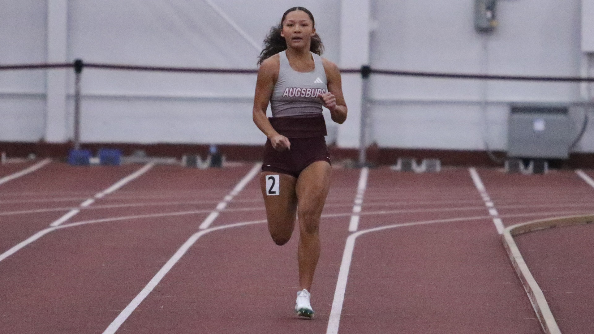 Nacia Griffin sprints during a 2025 Augsburg women's track and field meet.