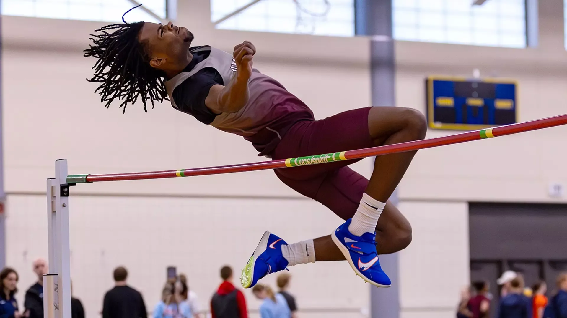 Shawn Huberty clears the bar in the high jump at a 2026 Augsburg track and field meet.