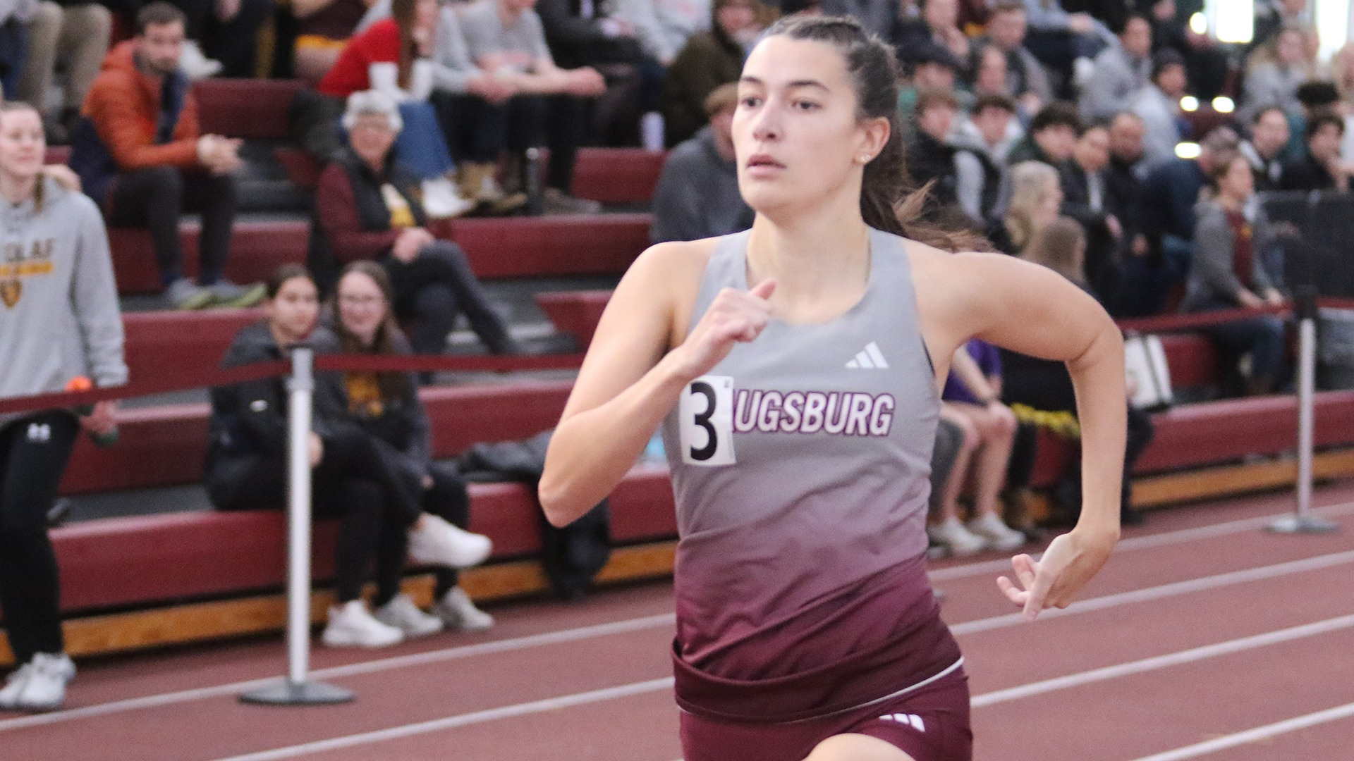 Allison Hookom runs during a 2025 Augsburg women's track and field meet.