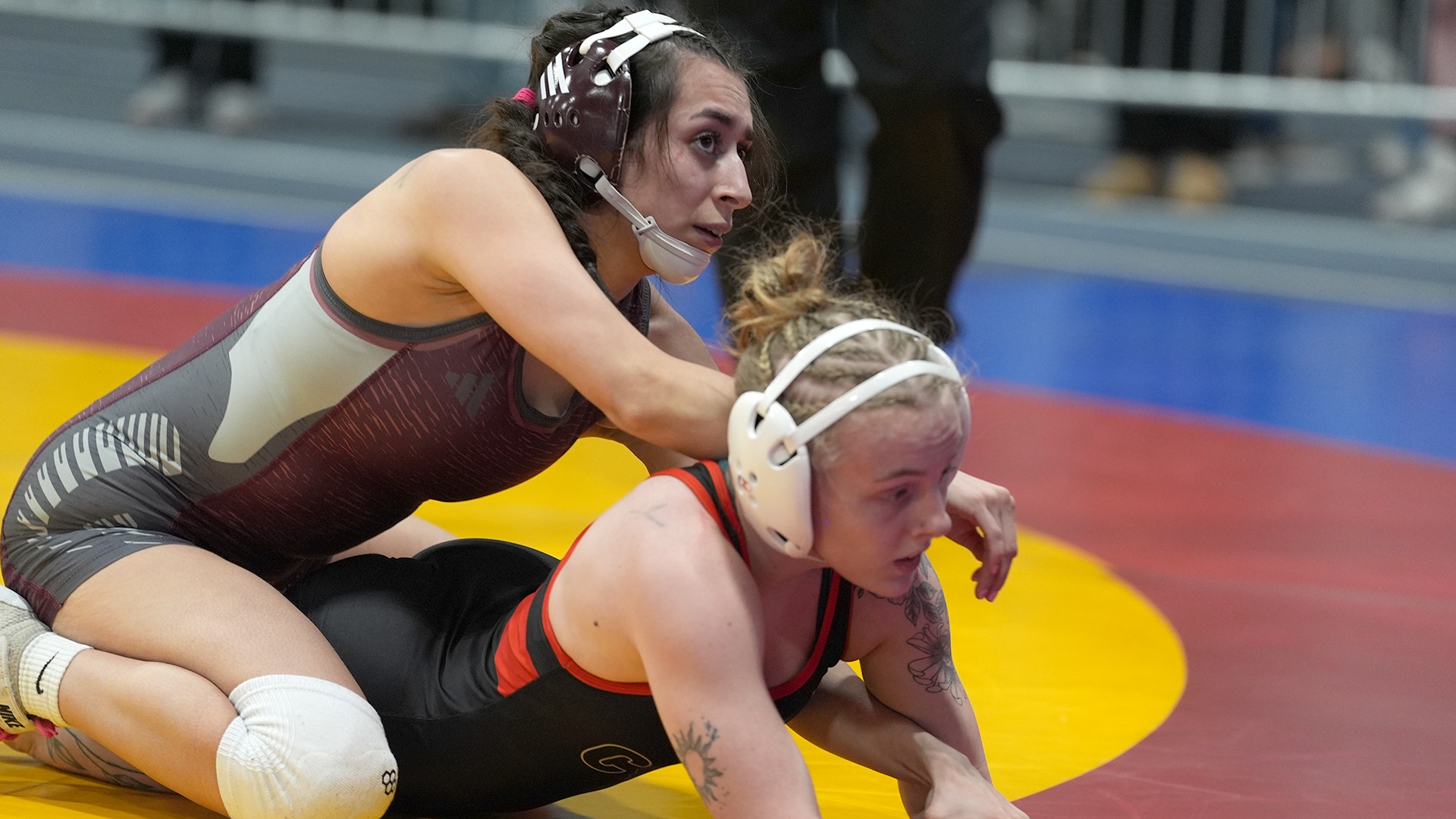 Gisele Gallegos has control of an opponent during a 2025-26 Augsburg women's wrestling meet.
