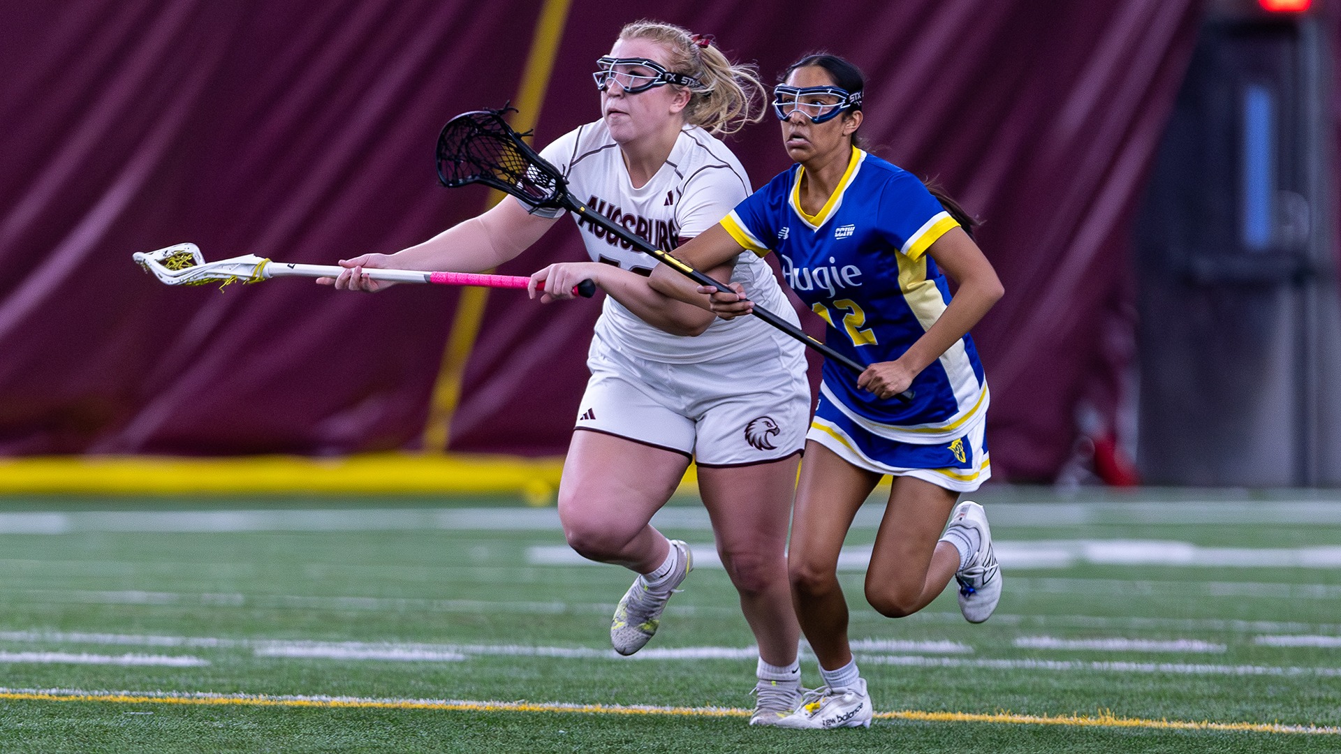 Breya Sawyer handles the ball during a 2026 Augsburg women's lacrosse game.