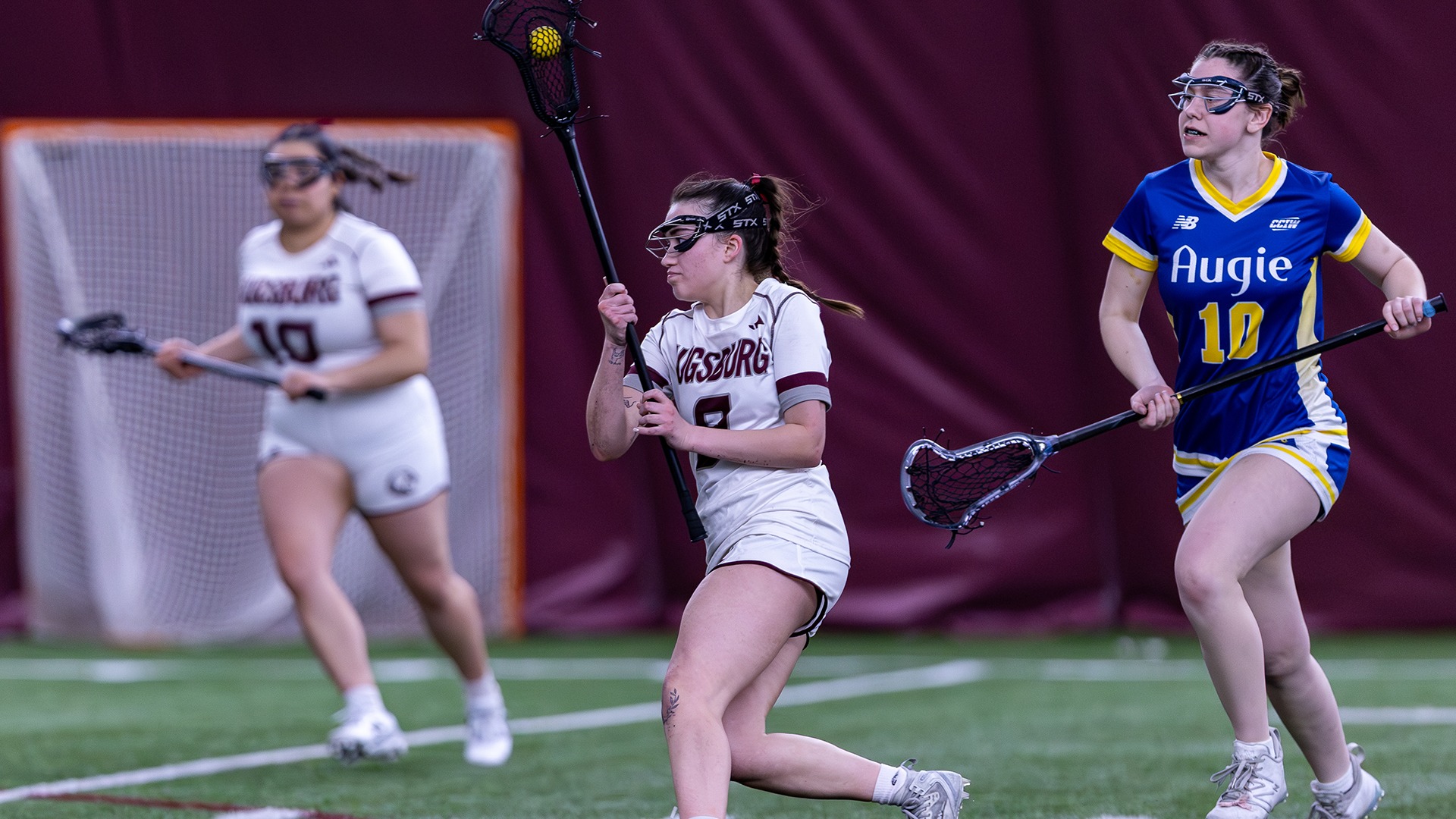Isabella Kohout handles the ball during a 2026 Augsburg women's lacrosse game.