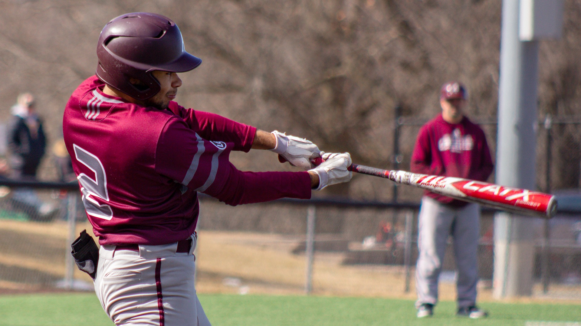 Stanley Regguinti swings at a pitch during a 2025 Augsburg baseball game.